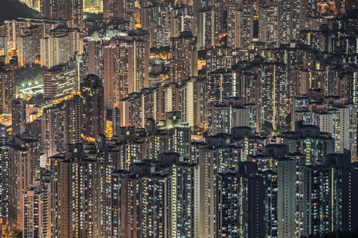 This amazing stacked architecture of Hong Kong shows the housing of its rather dense population. It's visually striking to understand that your whole horizon is built from people's lit windows. It shocks you that each life so big and important to the person himself and his close circle looks just like a tiny star in a huge sky next to millions of the same stars.